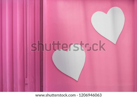White heart on pink wall