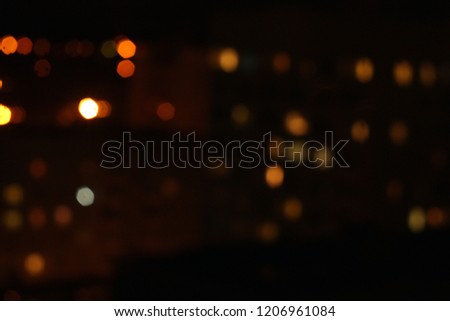 Defocused night lights of the city. Abstract background and texture for design.