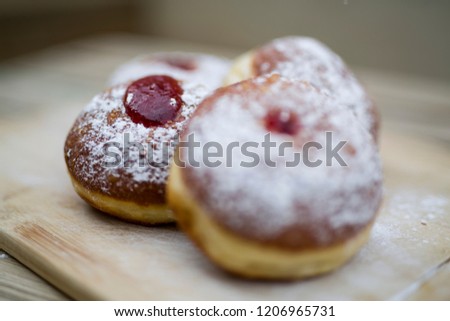 Traditional food for hanukkah is jelly doughnuts with sugar powder.