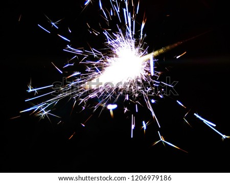 Multicolor Diwali Sparklers. Blue, Yellow and Red Sparkle background. Good for Diwali, Christmas and New Year celebrations. Abstract background of Blue, Yellow and white color. 