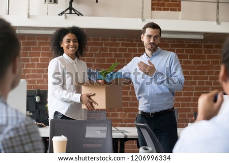 Friendly company ceo welcoming female african american employee introducing hired worker in multiracial office getting acquainted supporting new team member on first work day, introduction concept Royalty-Free Stock Photo #1206996334