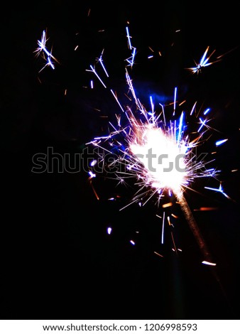 Multicolor Diwali Sparklers. Blue, Yellow and Red Sparkle background. Good for Diwali, Christmas and New Year celebrations. Abstract background of Blue, Red, Yellow and white color. 