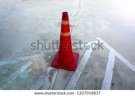 
    Plastic cone on cement floor     