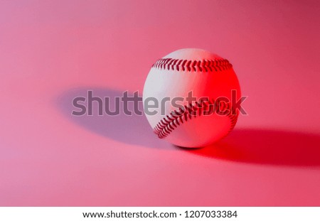 baseball on a Pink color background and red stitching baseball. copy space.