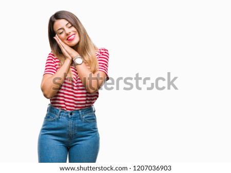 Young beautiful woman casual look over isolated background sleeping tired dreaming and posing with hands together while smiling with closed eyes.