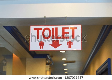 Direction to toilet signs for men and women.in the hotel.