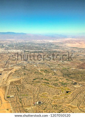 Aerial view while flying over Las Vegas through airplane window after taking off from Las Vegas USA.