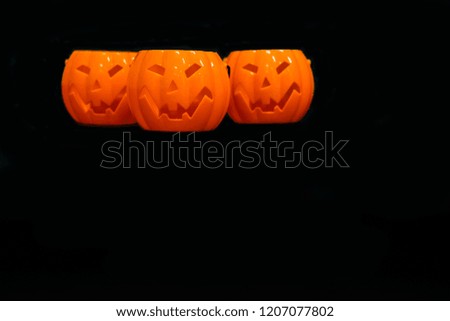 Plastic pumpkin with black background for Halloween day