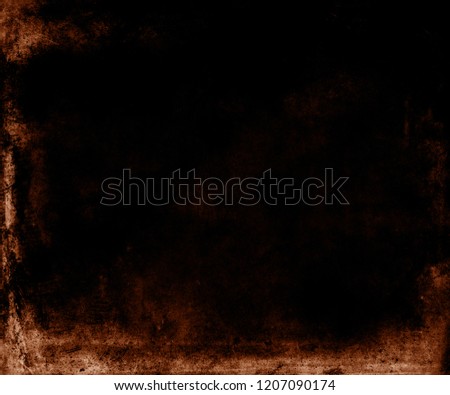 Black grunge halloween background with orange frame and space for your text or picture