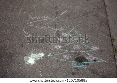 Abstract colorful children picture on asphalt (Christmas tree, heart, russian words)