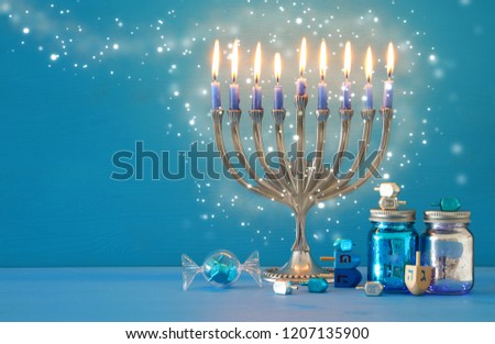 image of jewish holiday Hanukkah background with menorah (traditional candelabra) and candles
