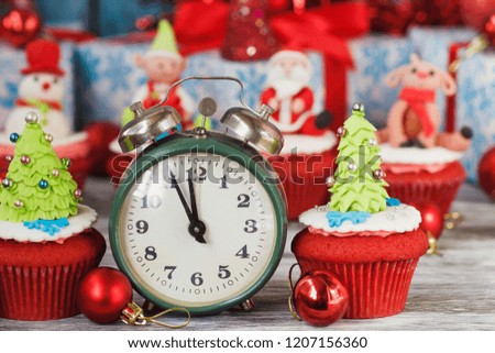 Christmas cupcake with colored decorations Christmas Tree made from confectionery mastic, soft focus background