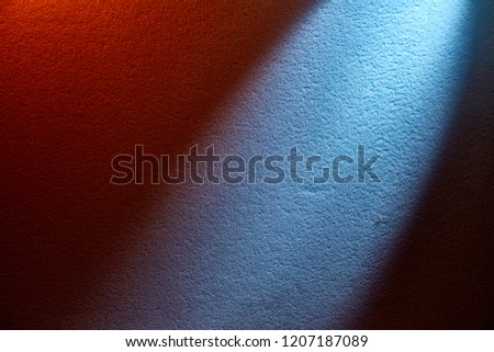 Light blue light on a red background.
