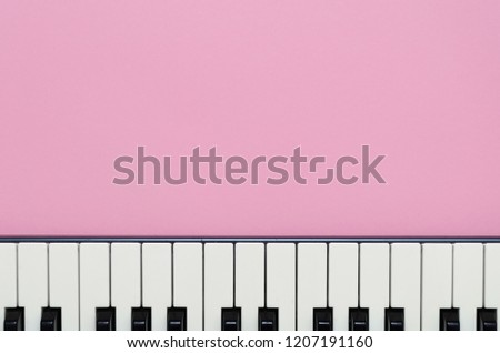Abstract pink background with a keyboard
