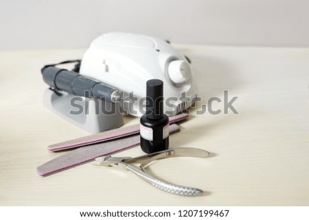 Manicure professional tools closeup. Electric nail professional manicure machine