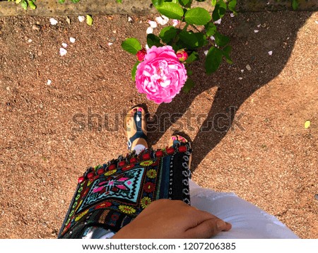 Woman feet and, flowers.