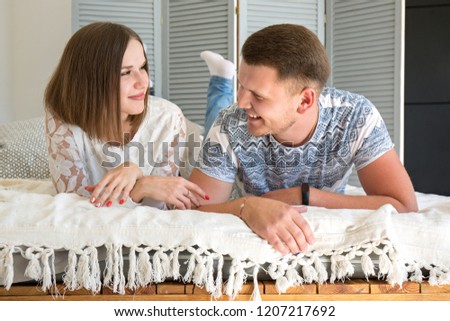 Young beautiful couple is resting at home