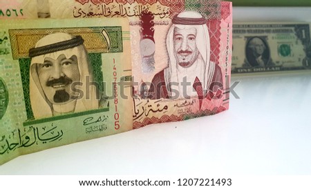 Saudi Arabia Riyal & One US Dollar -  Saudi Riyal Banknote has a Green Dome of The Prophet’s Mosque in Medina And the Picture of  King Salman / The Prophet’s Mosque in Al Madinah Al Monawarah