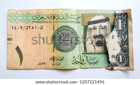 Saudi Arabia Riyal & One US Dollar -  Saudi Riyal Banknote has a Green Dome of The Prophet’s Mosque in Medina And the Picture of  King Salman / The Prophet’s Mosque in Al Madinah Al Monawarah