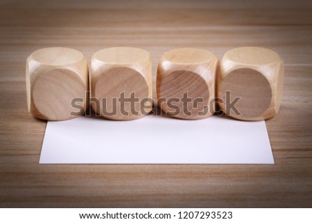 Blank wood blocks and white card on the table.