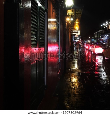 Gritty and rainy bourbon street, New Orleans at night