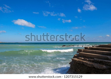 Wave splash on pier