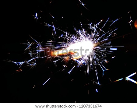 Multicolor Diwali Sparklers. Blue, Yellow and Red Sparkle background. Good for Diwali, Christmas and New Year celebrations. Abstract background of Blue, Yellow and white color. 