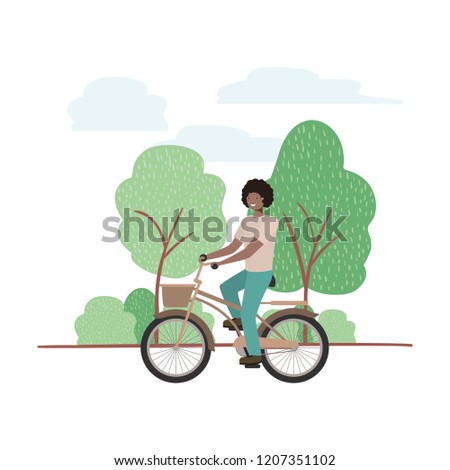 young man with bicycle in landscape