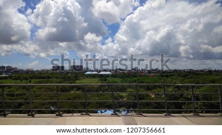 beautiful cloud formation with blue sky,seen with buildings surrounding the chennai city.wide angle photography at unidentified location.low light photography.