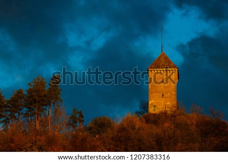 Church in Switzerland at night against dark cloudy sky