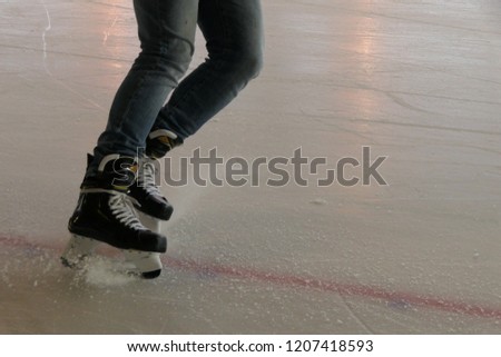 Close up breaking on ice, hockey stop