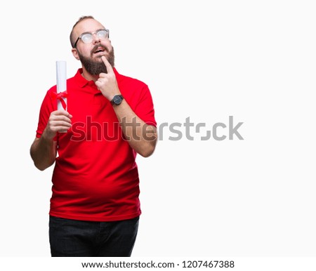 Young hipster man wearing glasses and holding degree over isolated background serious face thinking about question, very confused idea