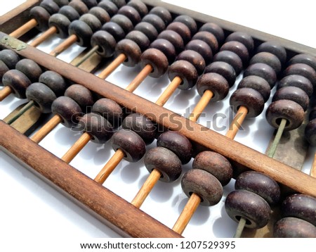 Retro abacus for calculating in the past most used in China lay down on white background