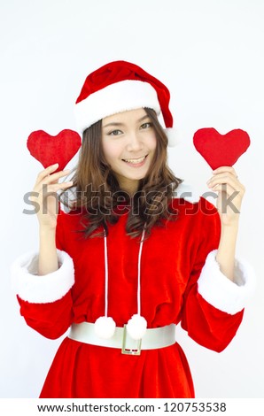 A Beautiful Asian santa woman in red cloth with red heart in her hand.