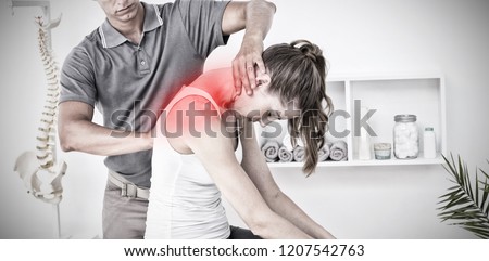 Highlighted pain against doctor doing neck adjustment Royalty-Free Stock Photo #1207542763