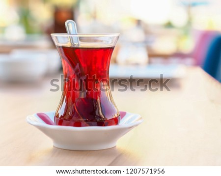 Turkish tea cup and classic tea cup mat on wooden table