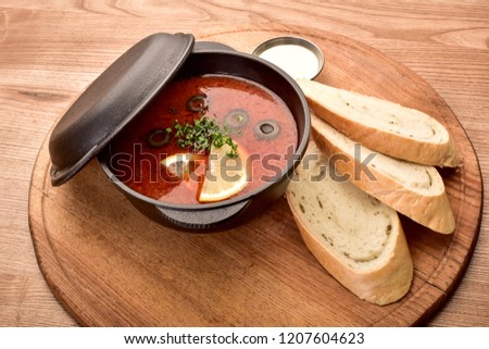 hodgepodge with bread on a wooden table