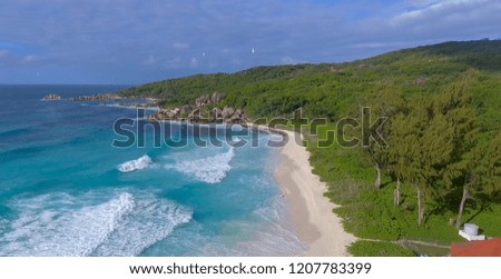 Panoramic view of Seychelles mountains and coastline from drone on a sunny day.