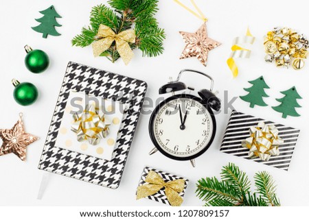 Collection of Christmas objects. Christmas  winter decorations, stationery with alarm clock and gifts on white background. Holiday and celebration creative concept. Flat lay, top view 