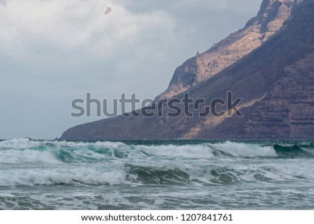 Water of Atlantic ocean, winter on Lanzarote island, Famara beach, famous destination for surfers and tourists