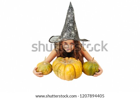 little girl with long hair in witch outfit on Halloween with pumpkins, emotionally expressions of mimic, acting, portrait on white background