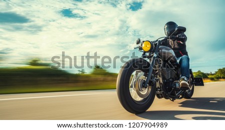 motorbike on the forest road riding. having fun driving the empty road on a motorcycle tour journey. copyspace for your individual text. Royalty-Free Stock Photo #1207904989