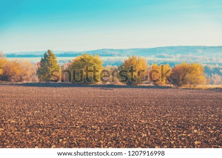 Arable field against mountains in autumn 