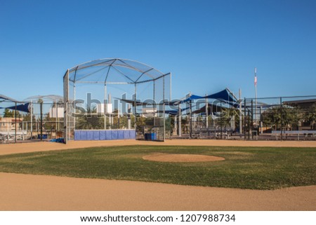 Baseball field under clear blue sky Royalty-Free Stock Photo #1207988734