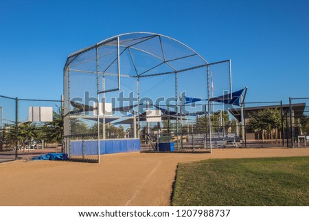 A baseball field batting cage Royalty-Free Stock Photo #1207988737