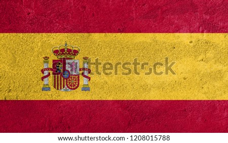  Spain flag painted on grunge wall.