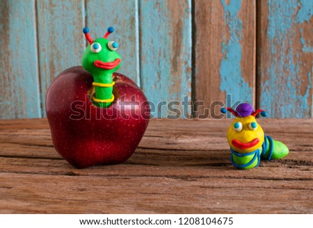 sweet apple. Apple and worm cartoons.space for text.