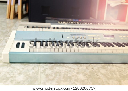 Old music electronic keyboard on the house floor - Modern Music instrument