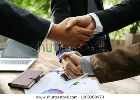 double businessman handshake , hardworking on negotiation to sign contract with partners