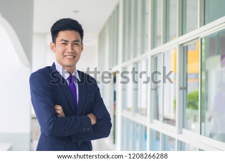 businessman, Young businessman standing with confidence and look good. About business. Royalty-Free Stock Photo #1208266288